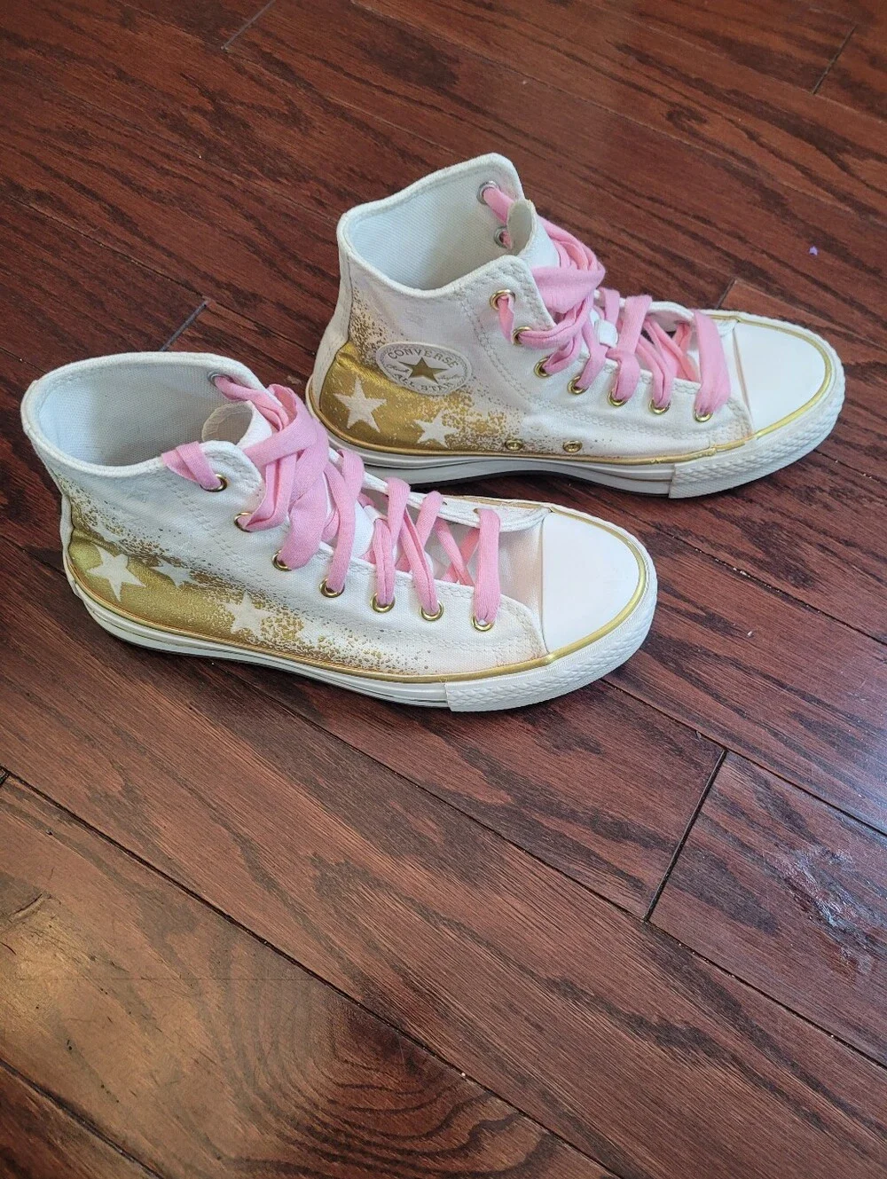White High-Top Converse Chuck Taylor Sneakers with Pink Laces